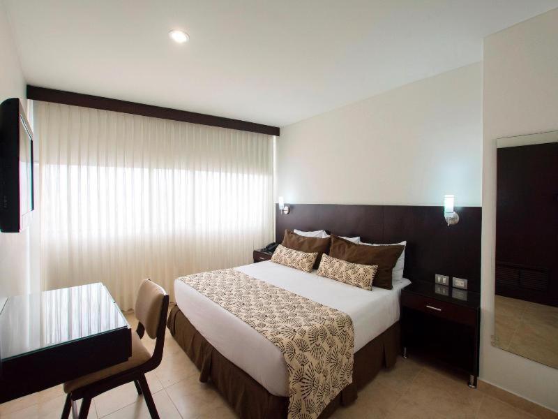 塞尔科蒂尔国际赌场酒店 Cúcuta 客房 照片 A bedroom at the hotel